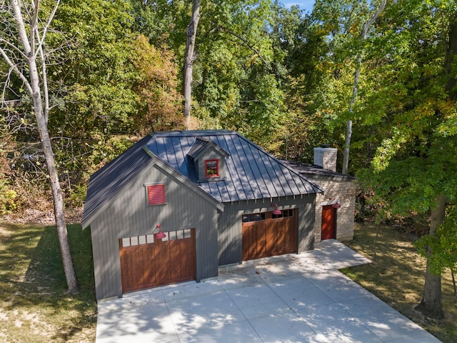 exterior space featuring an outbuilding and a garage