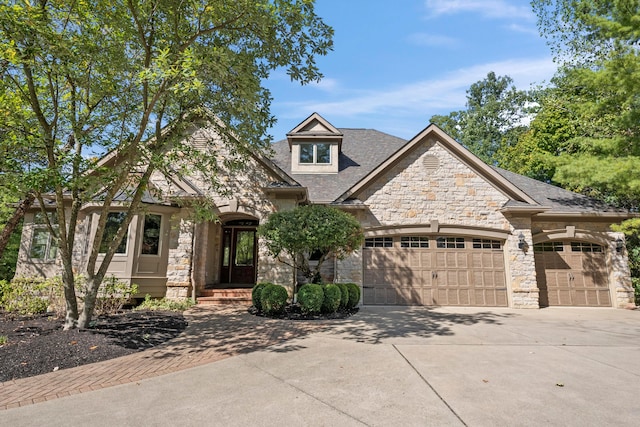 view of front of home with a garage