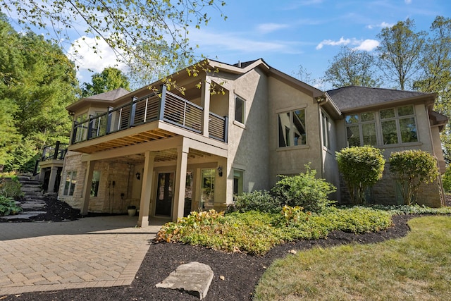 view of front of house featuring a balcony