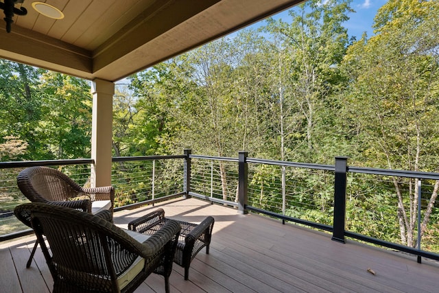 wooden terrace featuring ceiling fan