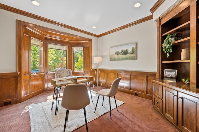 carpeted dining room featuring crown molding