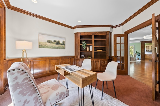 office space featuring crown molding, light hardwood / wood-style flooring, and french doors