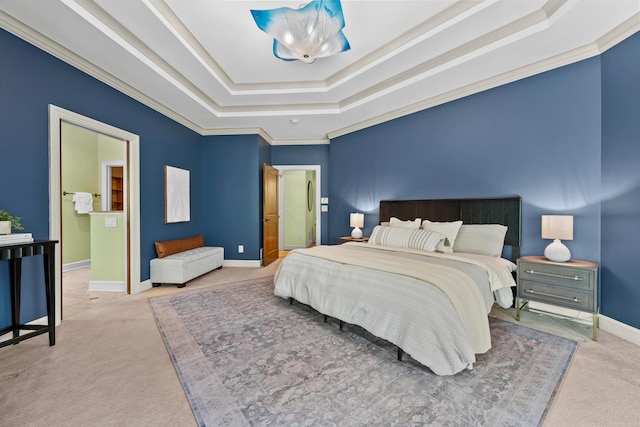 bedroom featuring carpet, a tray ceiling, and crown molding