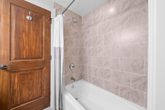 bathroom with shower / tub combo with curtain