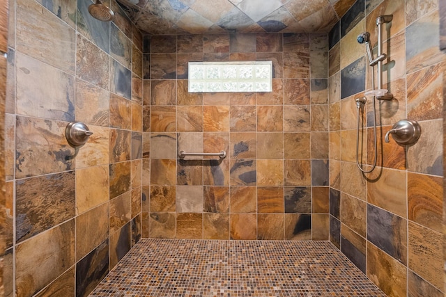 bathroom featuring tiled shower