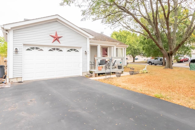 ranch-style house featuring a garage