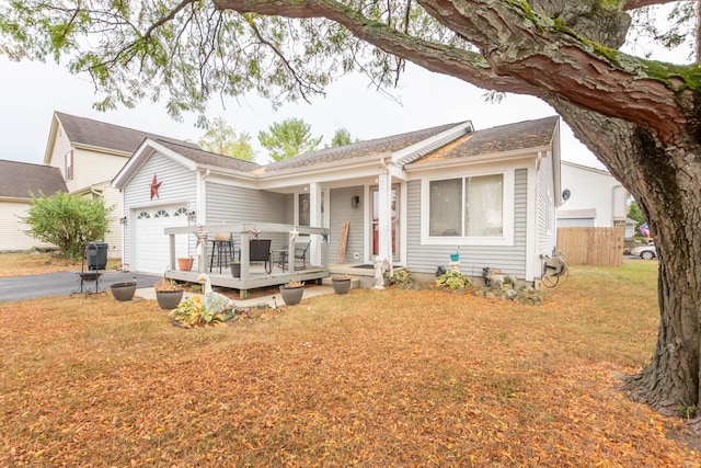 ranch-style house with a front lawn and a garage