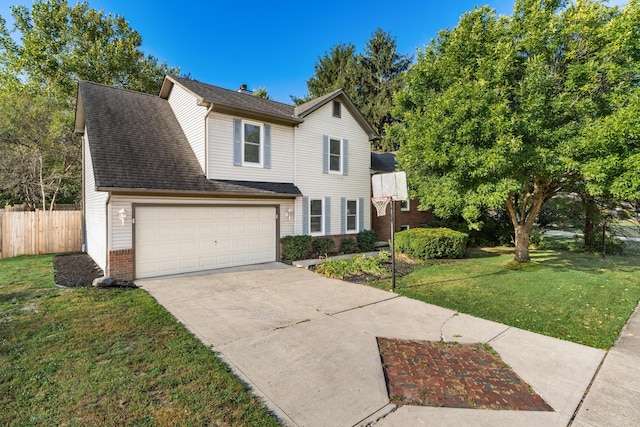 front of property featuring a front yard and a garage