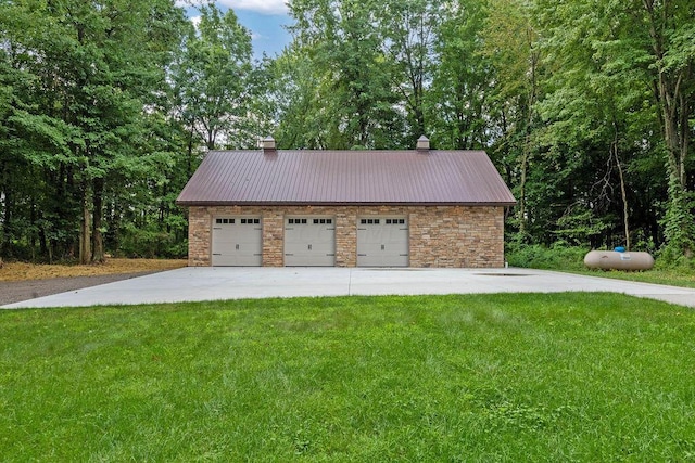 garage with a lawn