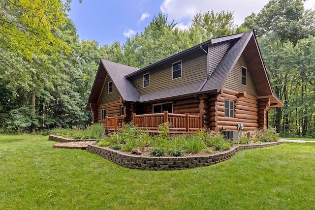 back of property with central AC unit, a lawn, and a wooden deck