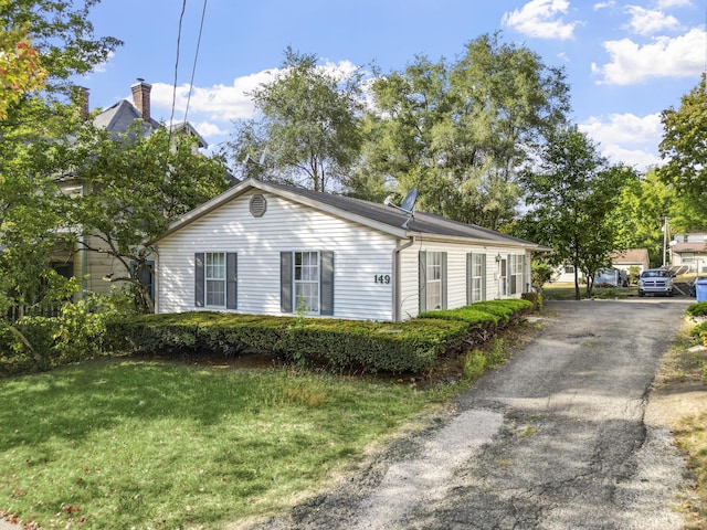 view of home's exterior featuring a yard