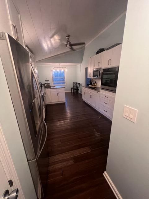 kitchen with white cabinetry, ceiling fan, dark wood-type flooring, and appliances with stainless steel finishes