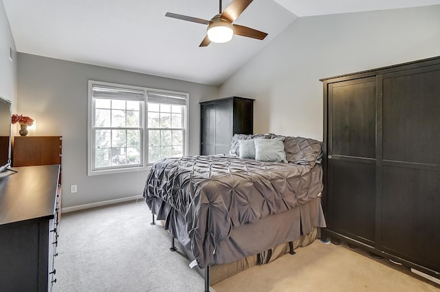 carpeted bedroom featuring ceiling fan and lofted ceiling