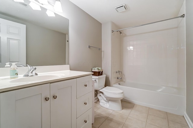 full bathroom featuring toilet, vanity, tile patterned floors, and tiled shower / bath