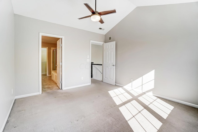 unfurnished room featuring ceiling fan, high vaulted ceiling, and light colored carpet