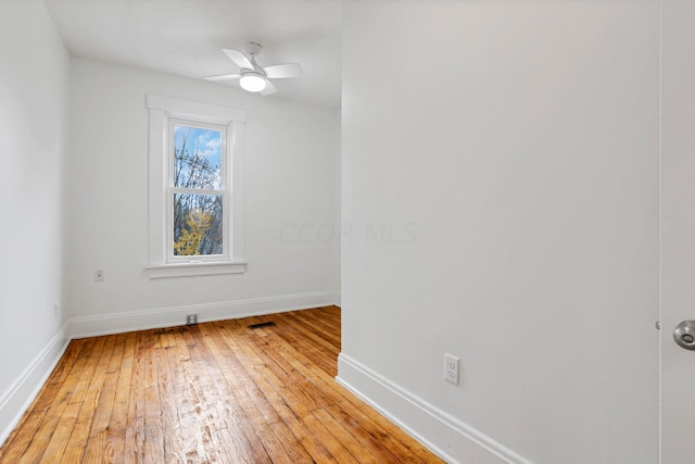 empty room with light hardwood / wood-style floors and ceiling fan