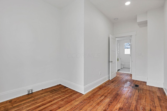 empty room with wood-type flooring