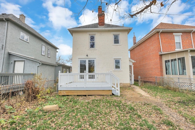 rear view of house with a wooden deck