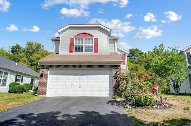 traditional-style home featuring brick siding, roof with shingles, an attached garage, and aphalt driveway