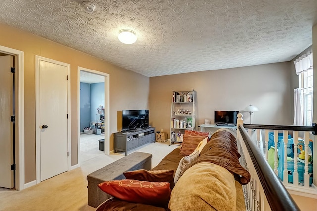 living room featuring light colored carpet and a textured ceiling