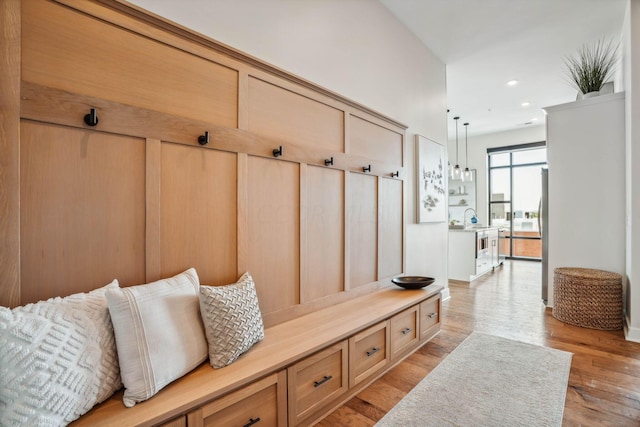 mudroom featuring sink and light wood-type flooring