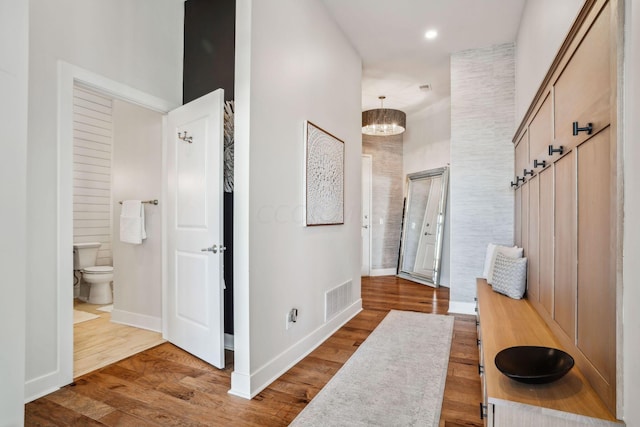 interior space featuring a notable chandelier and hardwood / wood-style flooring