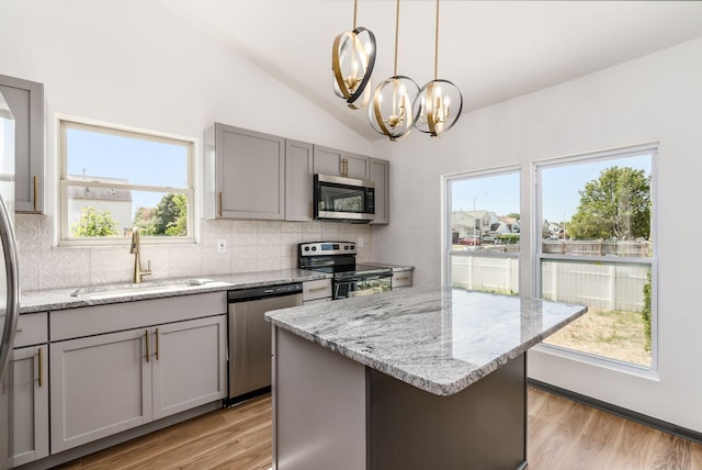 kitchen with a healthy amount of sunlight, sink, and appliances with stainless steel finishes