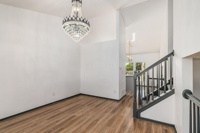 interior space featuring a notable chandelier and hardwood / wood-style flooring