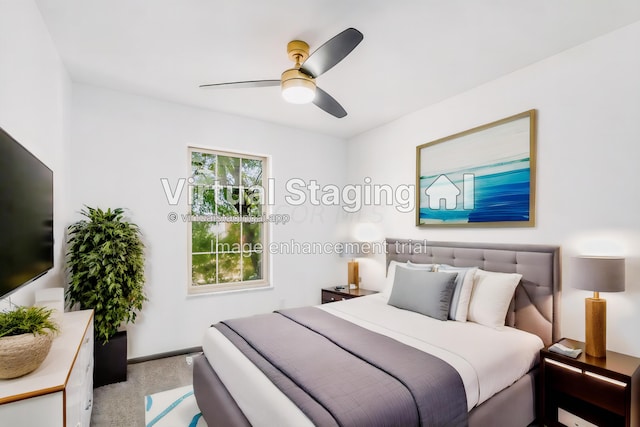 bedroom featuring ceiling fan and light colored carpet