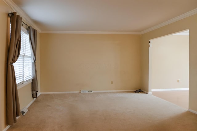 carpeted spare room with ornamental molding