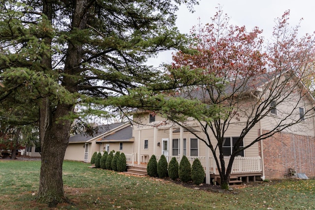 view of home's exterior with a yard