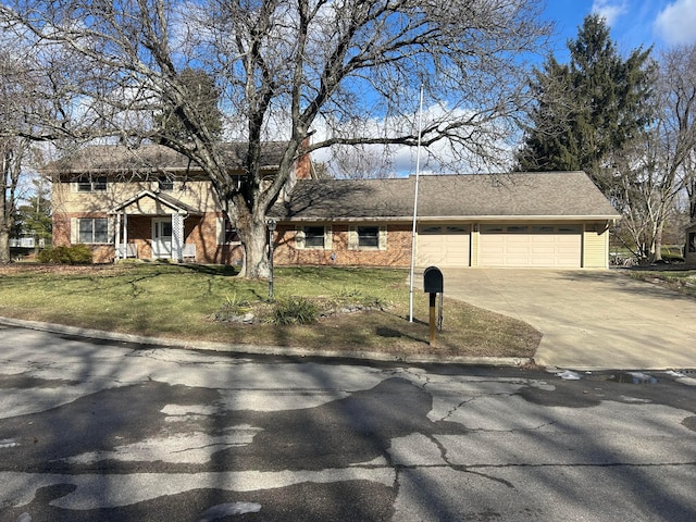 view of front of property featuring a garage and a front yard