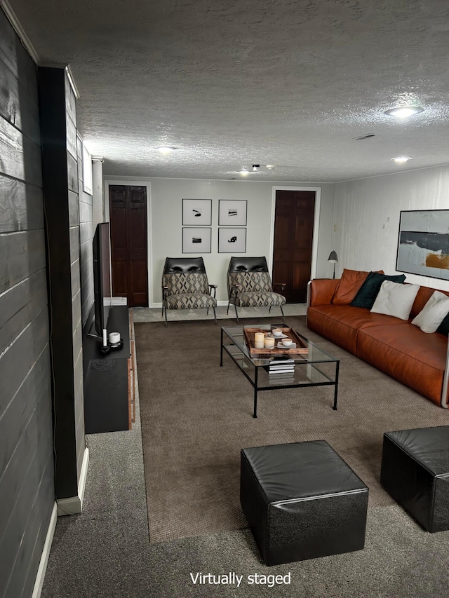 carpeted living room with a textured ceiling