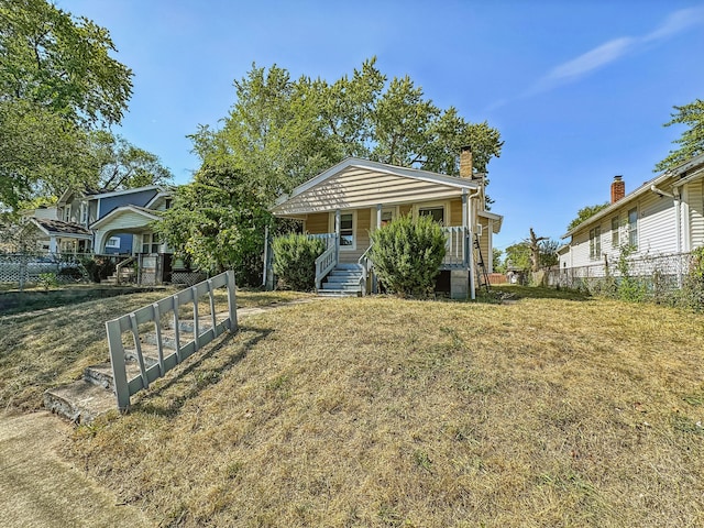 view of front of home featuring a porch and a front yard