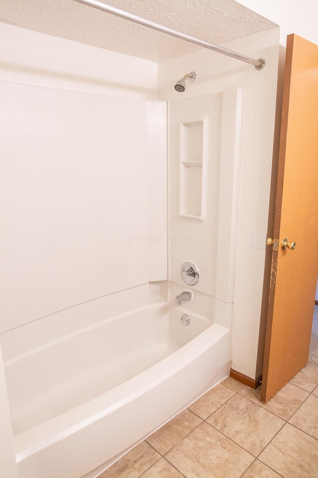 bathroom with bathing tub / shower combination and tile patterned flooring