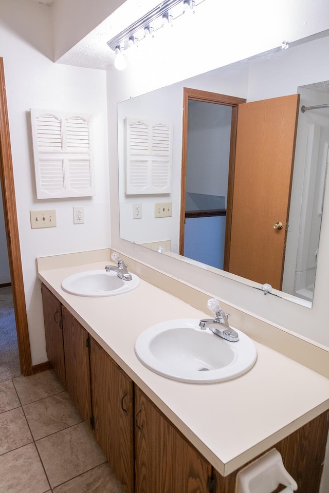 bathroom featuring tile patterned floors and vanity