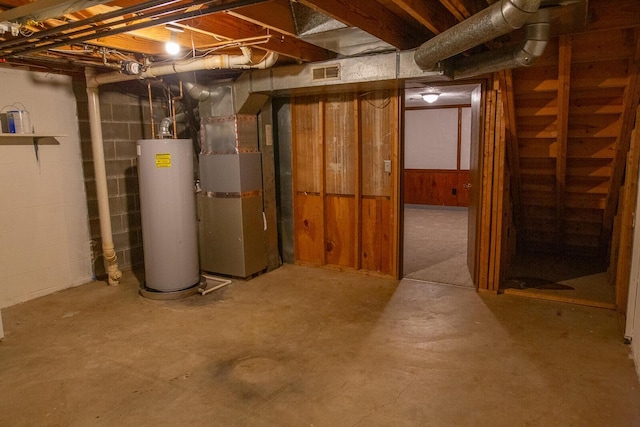 basement with gas water heater and heating unit