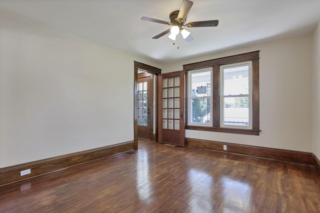 spare room with ceiling fan and dark wood-type flooring