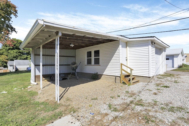 rear view of house with a carport