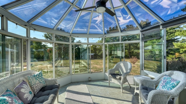 sunroom with ceiling fan and plenty of natural light