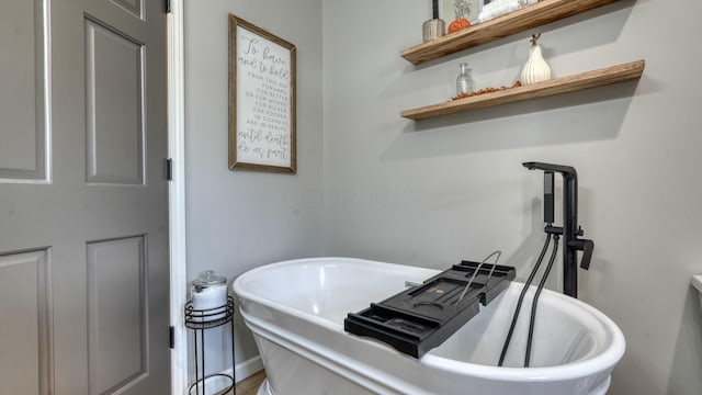 bathroom featuring a tub to relax in