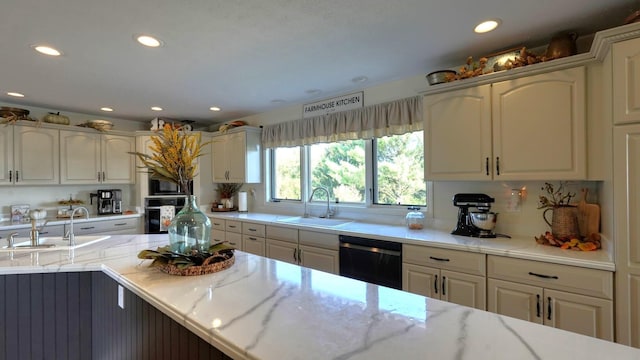 kitchen with tasteful backsplash, sink, stainless steel oven, and black dishwasher