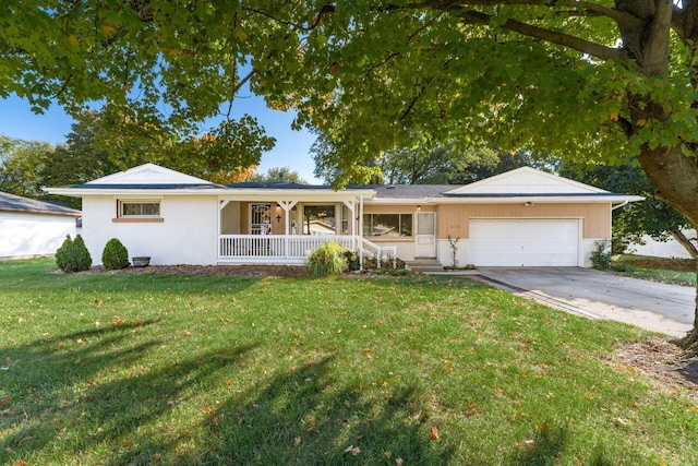 ranch-style home with a garage and a front lawn