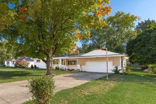 ranch-style home with a front yard and a garage