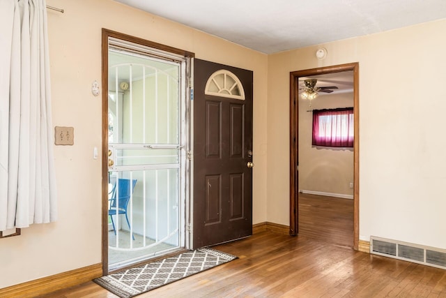 entryway with ceiling fan and hardwood / wood-style floors