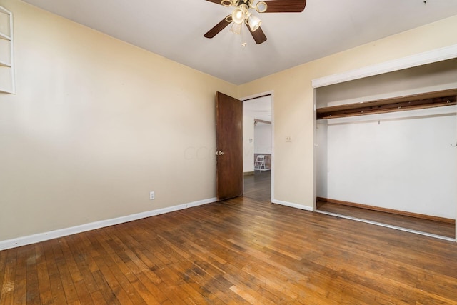 unfurnished bedroom with ceiling fan and wood-type flooring