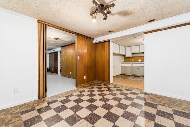 interior space featuring wood walls