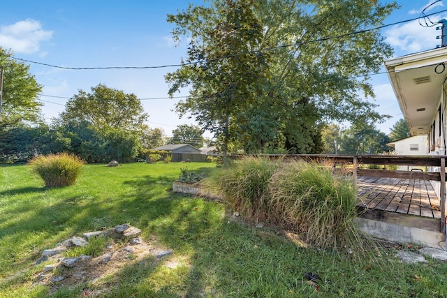 view of yard with a deck