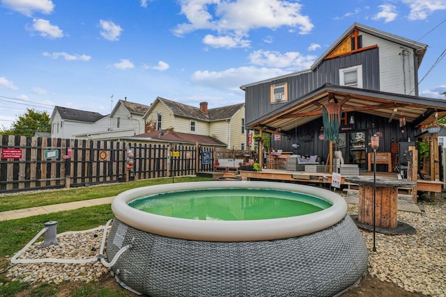 view of pool with a wooden deck