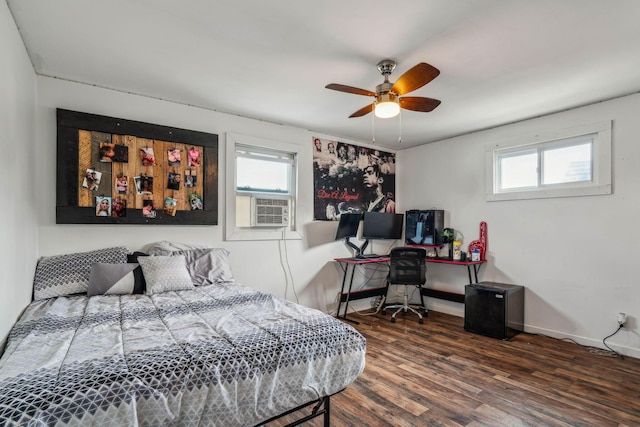 bedroom featuring cooling unit, ceiling fan, and dark wood-type flooring